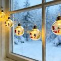 LED-lyskjede med julenissemotiv og gjennomsiktige kuler – 10 varmhvite LED-pærer – 2m