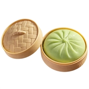 Ensfarget dumpling squishy stressleke med dampkurv - grønn