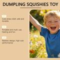 Squishy-leketøy mot stress i form av en dumpling med dampkoker-eske - rosa