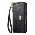 iPhone 16 lommebokveske med blomster- og bladmønster, glidelåslomme og håndleddsstropp - svart