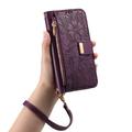 iPhone 16 lommebokveske med blomster- og bladmønster, glidelåslomme og håndleddsstropp - Lilla
