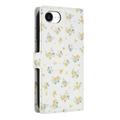 iPhone 16e Rombisk blomsterlommebok-etui - gule blomster